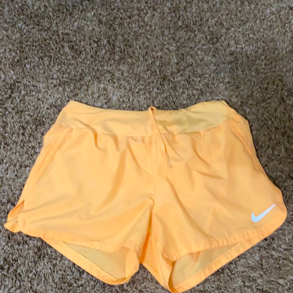 Orange nike shorts